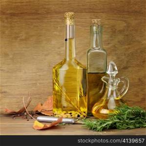 Cooking Oil And Spices On A Wooden Background