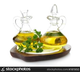 Cooking Oil Glass Bottles On Wooden Board