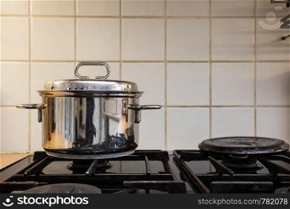 cooking pan on the gas stove, old design home cooking. cooking pan on the gas stove, old design