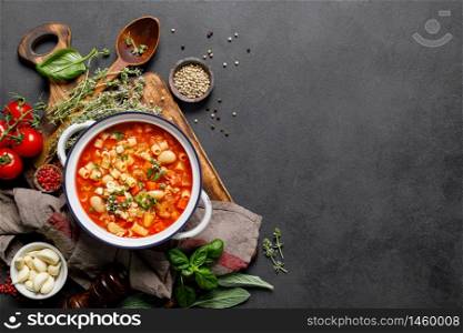 Cooking pasta e fagioli soup with chicken meat and vegetables, italian cuisine