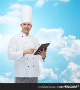 cooking, profession and people concept - happy male chef cook holding tablet pc computer over blue sky with clouds background
