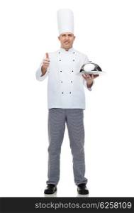 cooking, profession, gesture and people concept - happy male chef cook holding cloche and showing thumbs up