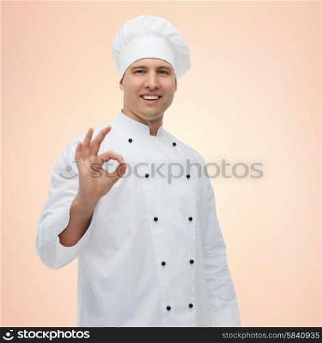 cooking, profession, gesture and people concept - happy male chef cook showing ok sign over beige background