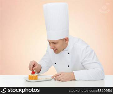 cooking, profession, haute cuisine, food and people concept - happy male chef cook decorating dessert over beige background