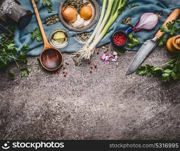 Cooking spoon with knife and cooking ingredients, food background, top view, border