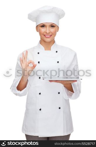 cooking, technology and food concept - smiling female chef, cook or baker with tablet pc computer and ok sign