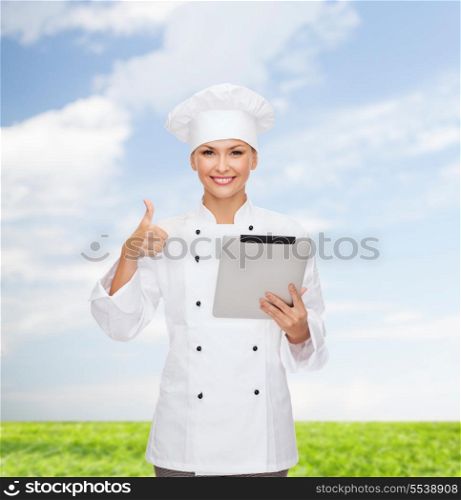 cooking, technology and food concept - smiling female chef, cook or baker with tablet pc computer showing thumbs up
