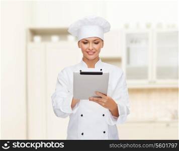 cooking, technology and food concept - smiling female chef, cook or baker with tablet pc computer