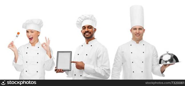 cooking, technology and people concept - happy chefs with tablet computer, cloche and cherry tomato on fork over white background. chefs with tablet computer, cloche and tomato