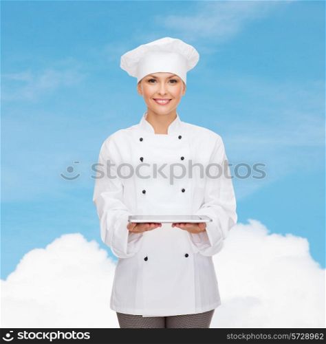 cooking, technology and people concept - smiling female chef, cook or baker with tablet pc computer over blue sky with cloud background