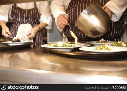 Cooks preparing a wedding meal