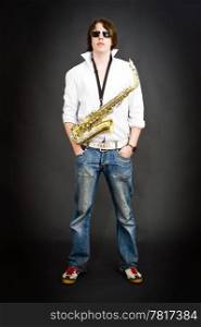 Cool dude posing with a saxophone strapped around his neck