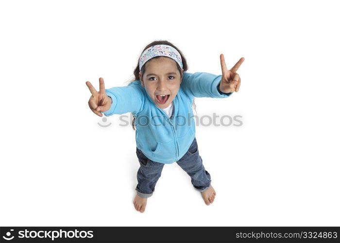 Cool eight year old girl yelling and making a V sign