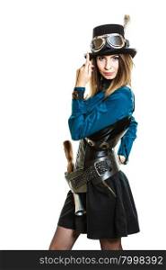 Cool girl in steampunk style.. Young steampunk islolated girl on white wearing fancy hat. Fantasy old fashion with stylish topper goggle and gun.
