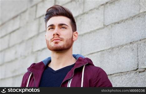 Cool handsome guy with beard looking at side