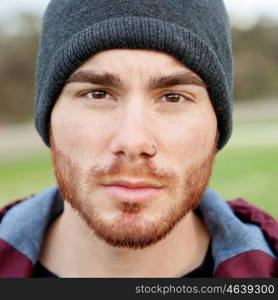 Cool handsome guy with piercing and beard