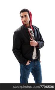 Cool handsome male wearing a red hoodie, black coat and jeans, with hands in pocket, isolated