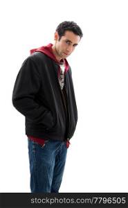 Cool handsome mischievous male wearing a red hoodie, black coat and jeans, with hands in pocket and head down, isolated