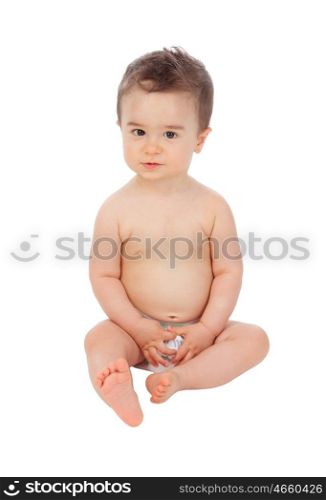 Cool little baby sitting on the floor with diaper isolated on a white background