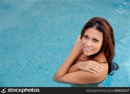 Cool pretty girl taking a dip in the pool