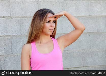 Cool pretty woman with pink t-shirt looking at side