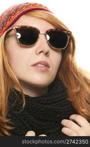 cool redhead woman wearing sunglasses in winter dress. cool redhead woman wearing sunglasses in winter dress on white background