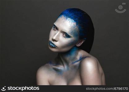 Cool Sexy Girl with Creative Festive Makeup. &#xA;Art makeup with Blue Hair and Rhinestones on a Lips.