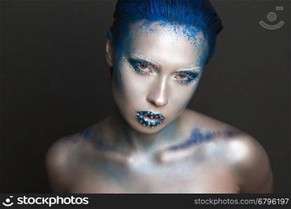 Cool Sexy Girl with Creative Festive Makeup. &#xA;Art makeup with Blue Hair and Rhinestones on a Lips.