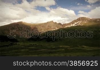 Cool summer mountain range time lapse with dramatic clouds in wilderness area of Colorado.