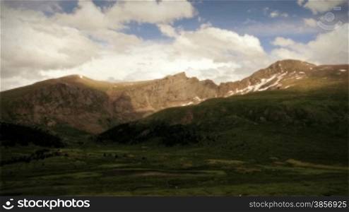 Cool summer mountain range time lapse with dramatic clouds in wilderness area of Colorado.