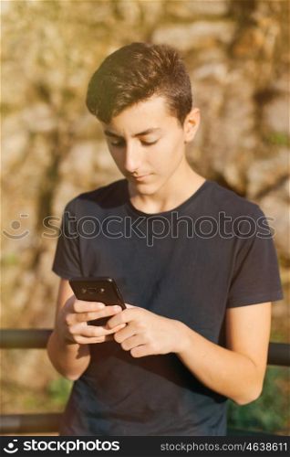 Cool teenager with fifty years old and a mobile on the street