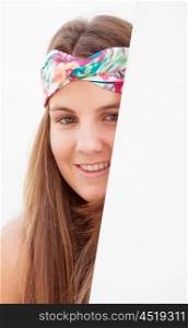 Cool trendy girl with a flowered hair scarf smiling