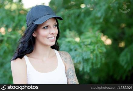 Cool woman with hat and shirt set walking in the forest