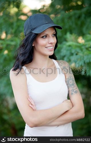 Cool woman with hat and shirt set walking in the forest