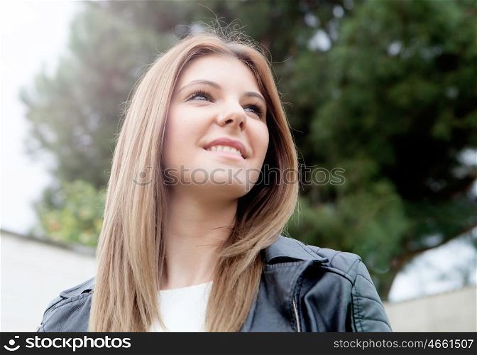 Cool young woman with black leather jacket