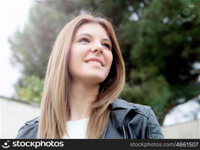 Cool young woman with black leather jacket