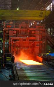 cooling hot steel on conveyor inside of steel plant