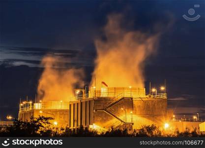 Cooling towers of a power plant with steam at night