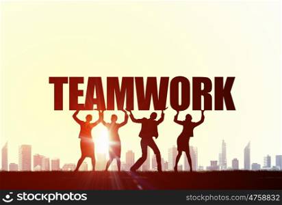 Cooperate for successful work. Business people lifting word teamwork representing collaboration concept
