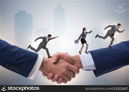 Cooperation concept with people running on handshake