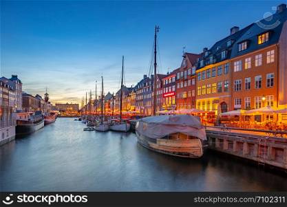 Copenhagen city at night with view of Nyhavn in Denmark.