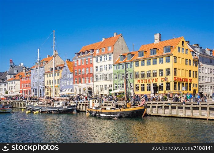 Copenhagen, Denmark - May 1, 2017: Nyhavn is a 17th-century waterfront, canal and entertainment district in Copenhagen, Denmark