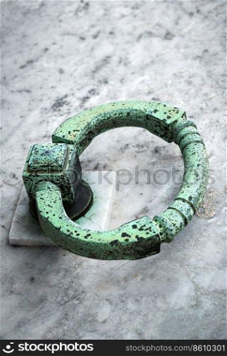 copper ring on the grave of the old cemetery