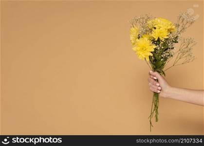 copy space woman hand with flowers