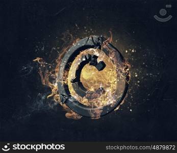 Copyright symbol burning in fire. Glowing fire copyright sign on dark background