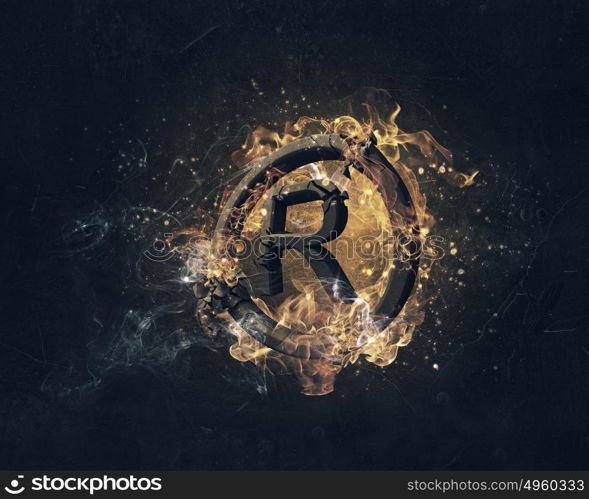 Copyright symbol burning in fire. Glowing fire copyright sign on dark background