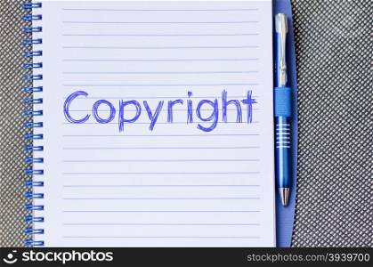 Copyright text concept write on notebook with pen