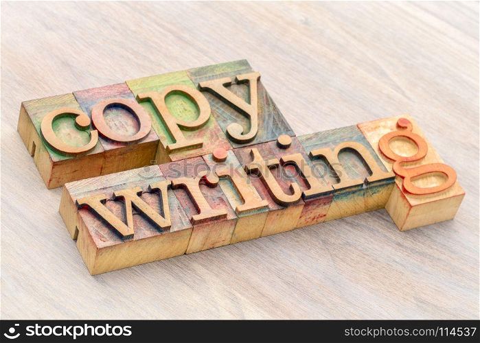 copywriting banner - word abstract in colorful letterpress wood type printing blocks against grained wood