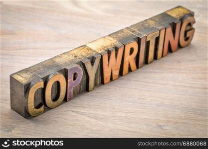 copywriting banner - word abstract in vintage letterpress wood type printing blocks against grained wood
