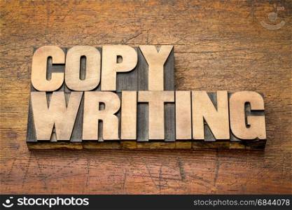 copywriting word in letterpress wood type. copywriting word in letterpress printing blocks against rustic wood